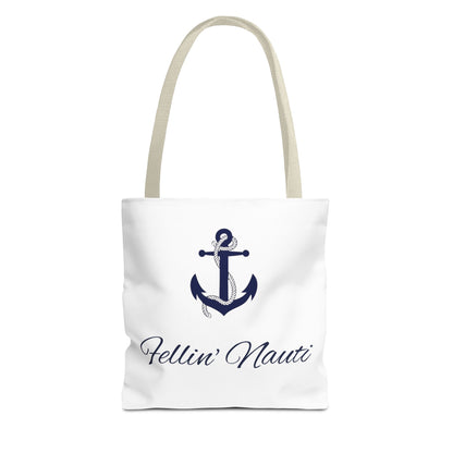A white canvas tote bag with beige shoulder straps, featuring a navy blue anchor graphic and the script text 'Fellin' Nauti' printed on the front, set against a plain white background.