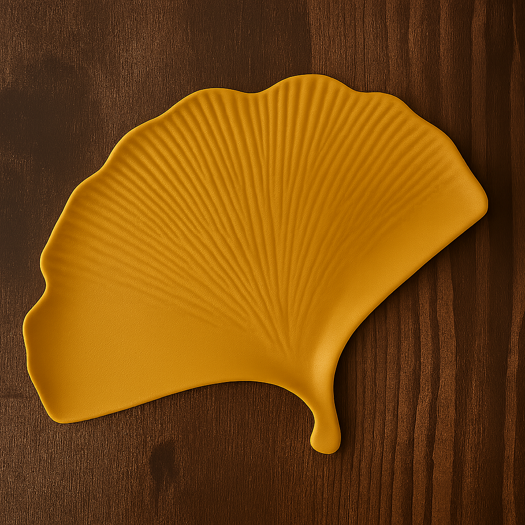 Yellow leaf-shaped plate on a wooden surface