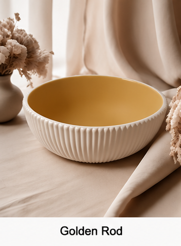 A cement bowl with a ribbed white exterior and a smooth golden-yellow interior, shown on a beige draped surface with dried flowers in the background. The text 'Golden Rod' appears at the bottom.