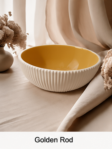 A cement bowl with a ribbed white exterior and a glossy mustard-yellow interior, styled on a beige fabric surface with dried flowers and soft draped curtains in the background. Text at the bottom reads 'Golden Rod'.