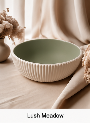 A cement bowl with a ribbed cream exterior and a muted sage green interior, styled on a beige fabric surface with dried flowers and draped cloth. The text 'Lush Meadow' appears at the bottom.