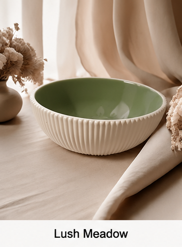 A cement bowl with a ribbed fluted exterior and a muted sage green interior, styled on a beige fabric surface with dried flowers and soft draped curtains in the background. Text at the bottom reads 'Lush Meadow'.